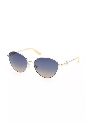 Occhiali da sole con montatura in metallo, lenti ovali sfumate di blu e terminali beige sulle aste, mostrati inclinati su sfondo bianco.