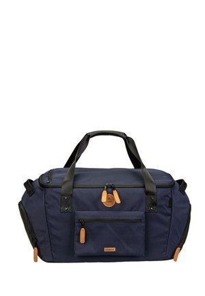 Sac de sport bleu marine avec poignées noires, tirettes de fermeture éclair marron, poche avant et compartiments latéraux zippés, conçu pour les voyages et l'utilisation en salle de sport.