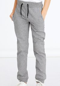 Gray sweatpants made of soft cotton blend, featuring an elastic waistband with black drawstrings, side pockets, and tapered cuffs.