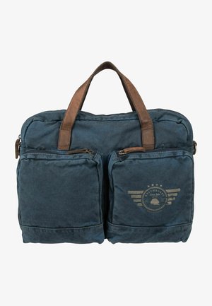 Borsa in tela blu scuro con manici in pelle marrone, dotata di due tasche frontali con zip e un logo stampato con dettagli di ali.