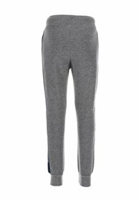 Grijze katoenen joggers met een elastische tailleband, taps toelopende boorden, zijdetail in marineblauw en een zachte textuur. Geen zichtbare zakken.