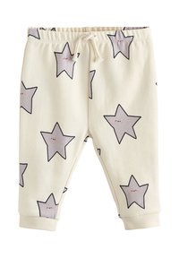 Pantalon beige clair avec motifs d'étoiles grises, taille élastique avec cordon de serrage ajustable, et poignets côtelés aux chevilles. Texture de tissu douce.