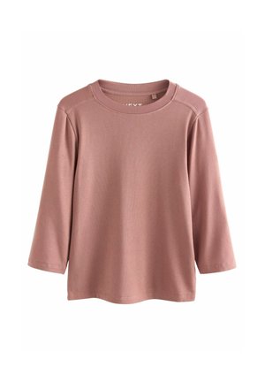 Rebrast dolg rokav v nežno roza barvi. Ima okrogel izrez in rahlo ohlapen kroj s tremi četrtinami rokavi. Trpežna tekstura tkanine.