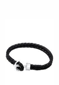 Musta punottu nahkarannekoru, jossa on hopeinen ankkurimuotoinen lukko ja teksturoitu kierrettävä yksityiskohta lähellä suljetta.