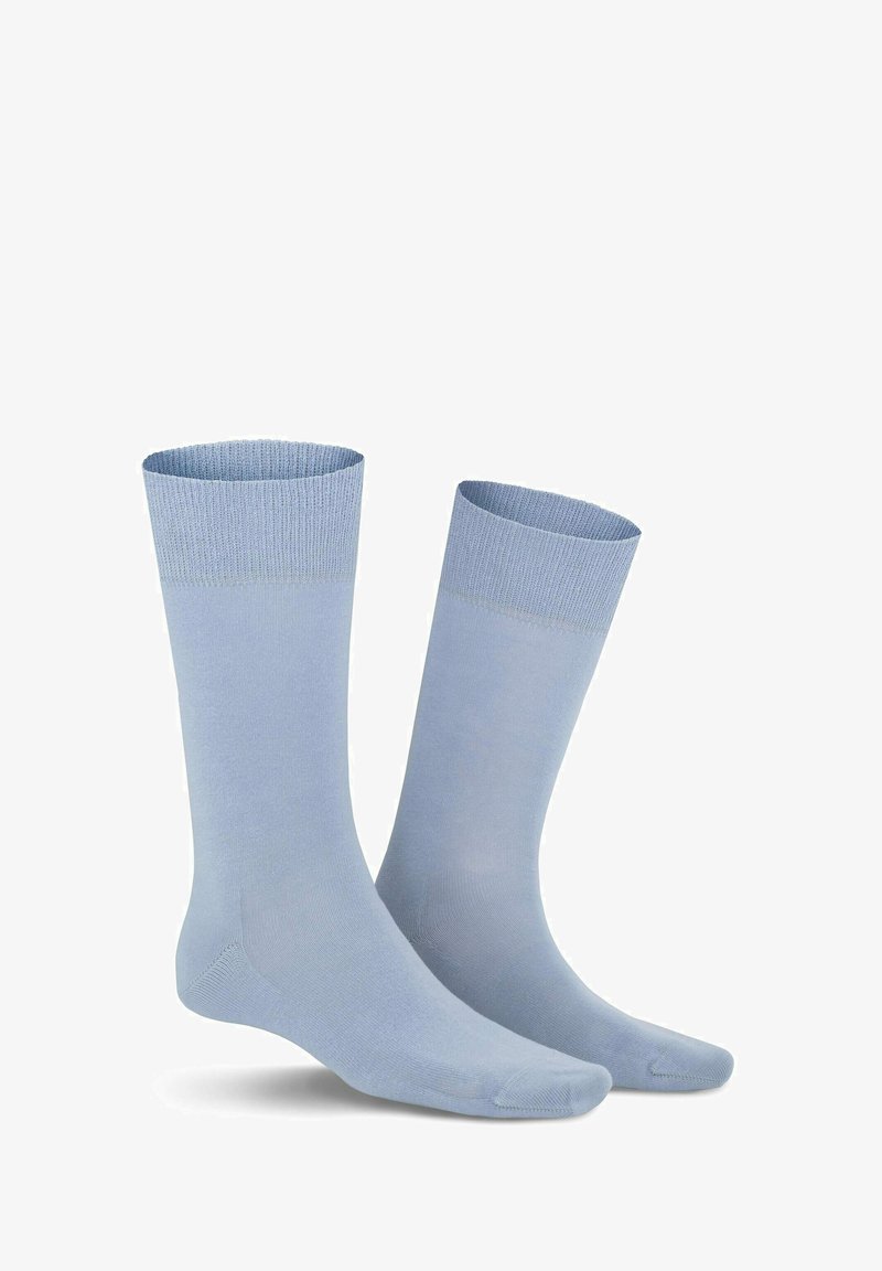 Light blue cotton socks with ribbed cuffs, smooth texture, reinforced heels and toes, and a classic crew design.