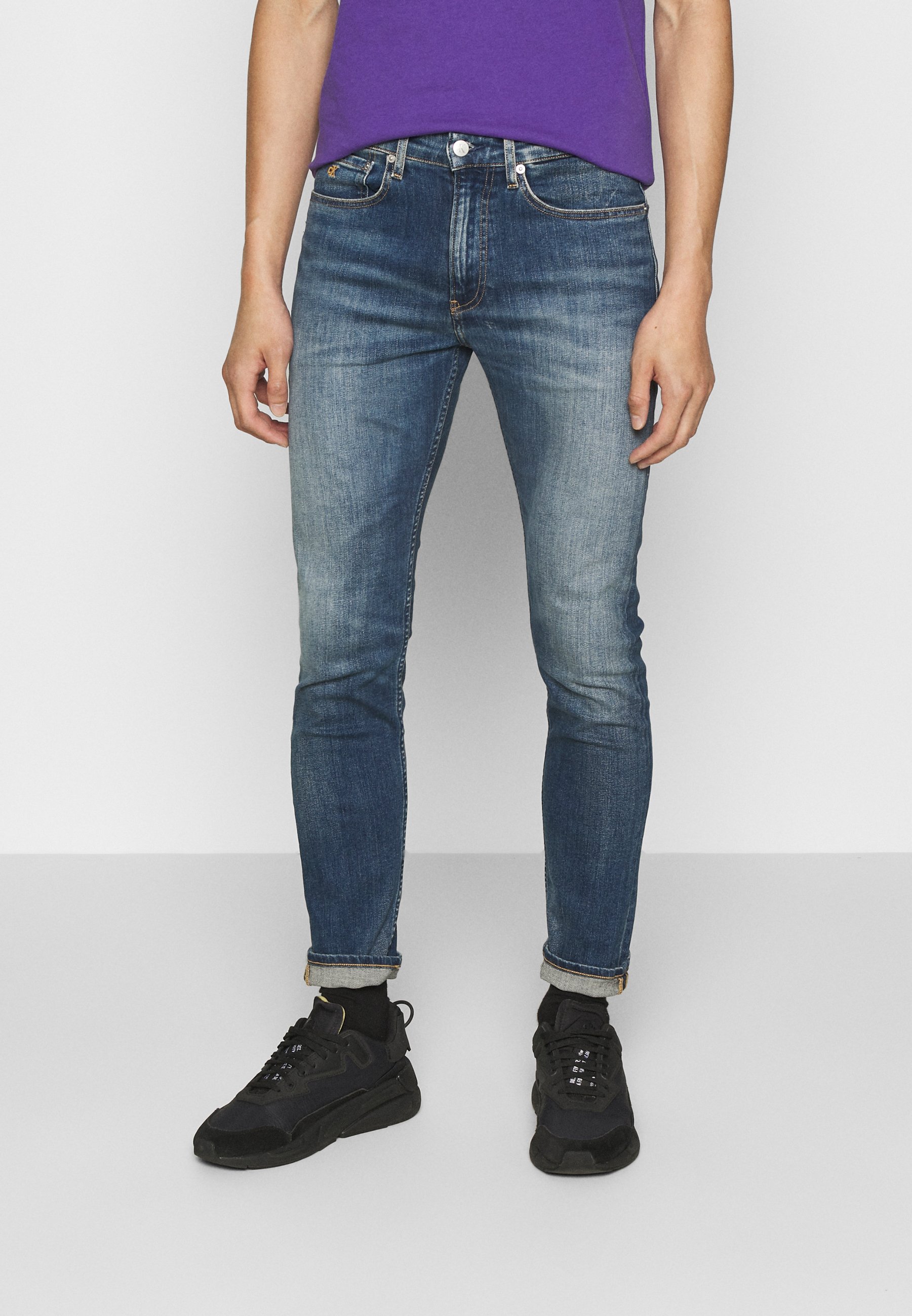 bright blue skinny jeans