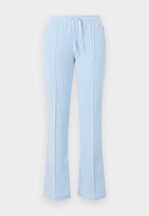 Helle blaue Jogginghosen aus weichem Stoff mit einem Kordelzugbund, seitlichen Taschen und einem ausgestellten Design mit kontrastierenden Nähten.