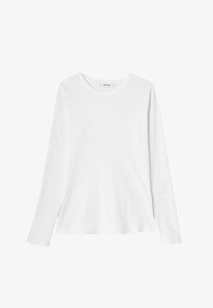 T-shirt blanc à manches longues en coton doux, doté d'un col rond et d'échancrures sur les côtés à l'ourlet pour plus de liberté de mouvement.