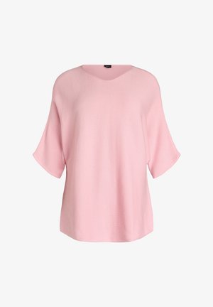 Lichtroze geribbelde gebreide top met een V-hals, korte brede mouwen en een losse pasvorm. Soepele textuur met minimale details.