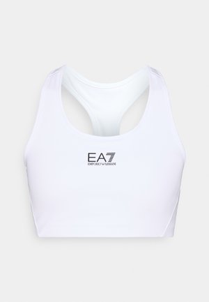 Hvit sports-BH laget av glatt stoff med racerback-design. Viser en svart EA7-logo foran og har tynne skulderstropper.