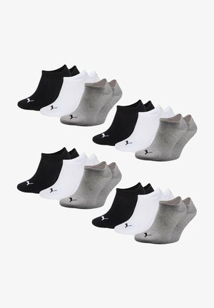 An assortment of ankle socks in black, white, and gray, featuring a soft fabric, elastic cuffs, and a small logo on each sock.