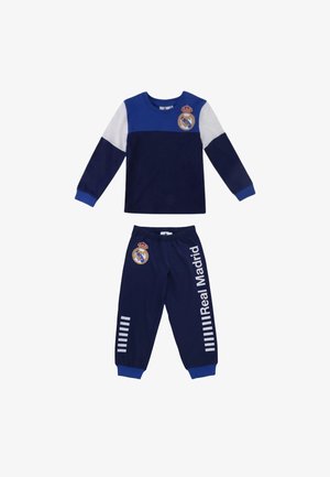 Tuta da bambino Real Madrid a due pezzi con maniche lunghe, colori blu navy e bianco, e logo della squadra su maglietta e pantaloni.