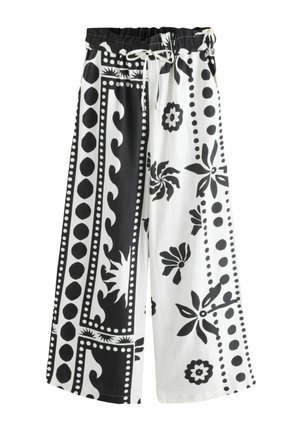 Sorte og hvide brede benbukser med elastik i taljen, der har blomster- og geometriske mønstre i en blanding af solide og konturerede designs.