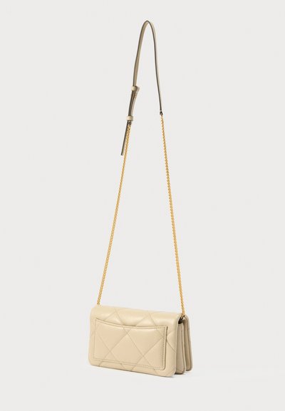 Quilted beige leather crossbody bag with a gold chain strap, featuring a rectangular shape, front pocket, and smooth texture.