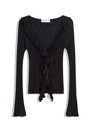 Top noir à côtes featuring un décolleté en V profond, un ourlet volanté le long de l'encolure et à l'avant, des manches longues et une fermeture à nouer à la taille.