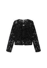 Schwarze, langärmlige, cropped Spitzenjacke mit floralem Muster und drei vorderen Bindeschließen, die eine schwarze Unterlage zeigt.