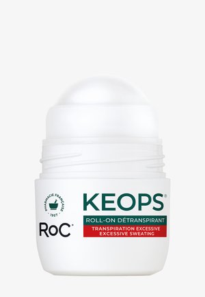 Déodorant roll-on blanc étiqueté Keops par RoC pour transpiration excessive avec texte en français et en anglais sur le contenant.