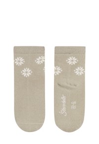 Beige Socken mit weißen Schneeflockenmuster, aus weichem Stoff gefertigt. Verfügt über gerippte Bündchen und einen verstärkten Zehenbereich.