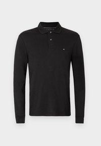 Polo shirt nero a maniche lunghe in cotone, con colletto, chiusura a tre bottoni e un piccolo logo sul petto.
