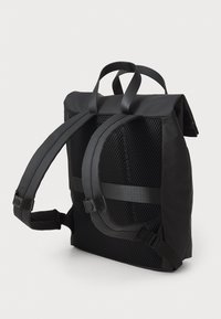 Black backpack with a textured mesh back, adjustable padded straps, and a rolled top closure. Features durable material and minimal design.