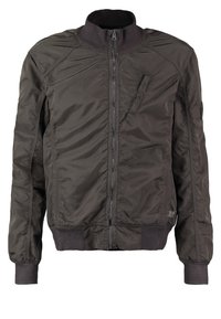 Mørkegrøn bomberjakke lavet af letvægts nylon med ribbet krave, lynlåslommer og elastiske manchetter for et tætsiddende look.