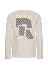 Camicia beige a maniche lunghe con un grande logo geometrico a strisce nere, testo giallo "Nuove visioni" e testo più piccolo in nero e giallo sotto.