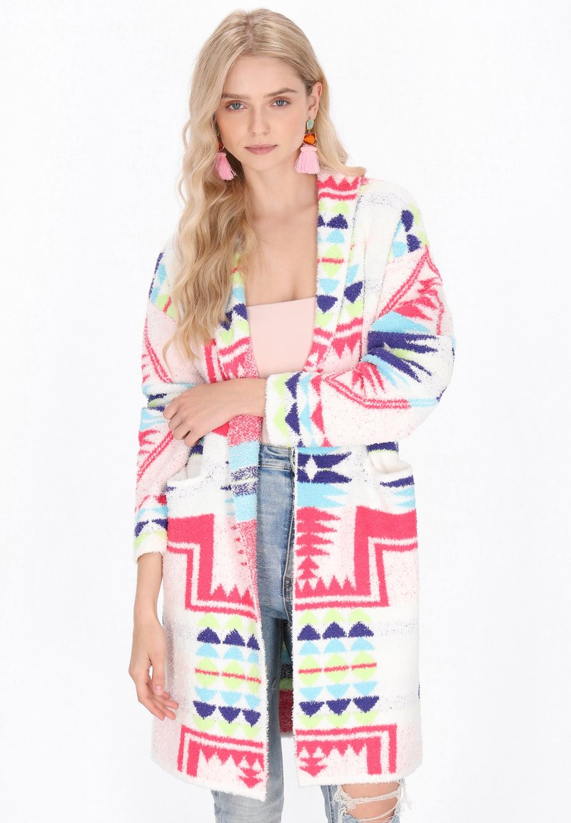 Kleurrijke cardigan met geometrische patronen in roze, blauw en groen. Zachte, gestructureerde stof met een open voorkant en twee voorzakken.