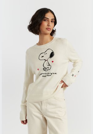 Crème sweater met een zwart geborduurd Snoopy-graphic en rode harten. Lange mouwen met geribbelde boorden; ontspannen pasvorm.