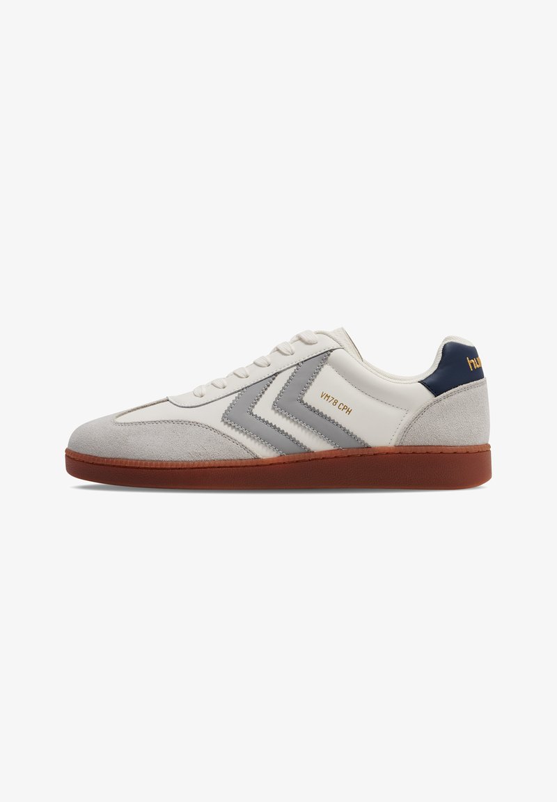 White sneaker with gray suede and leather accents, featuring a brown rubber sole, lace-up design, and logo detailing on the side.
