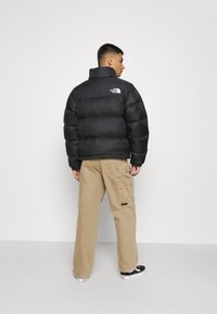 The North Face - RETRO NUPTSE JACKET - Daunenjacke - black Thumbnail-Bild 1