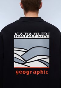 Black sweatshirt featuring a graphic print of abstract blue waves and the text "NAPAPIJRI" above and "geographic" below in orange.