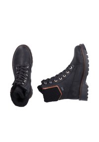 Botas de tobillo de cuero negro con un cuello de punto texturizado, puntera redonda, ojales de metal y suela resistente. Diseño ligero y robusto.