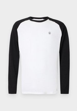 T-shirt à manches longues à col rond avec un corps blanc et des manches raglan noires. Présente un petit logo sur la poitrine. Confectionné en coton.