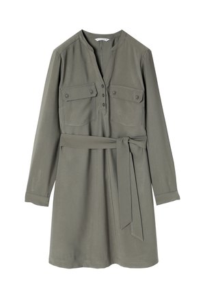 Khaki shirt dress with long sleeves, buttoned front, two chest pockets, and a tie belt at the waist. Smooth fabric with a slight sheen.