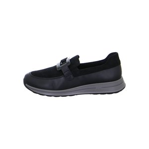 Black slip-on shoe with suede upper, leather accents, gray rubber sole, and decorative buckle across the top, side view.