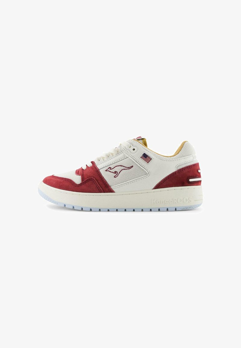 White and red sneaker with suede and mesh materials, featuring a round toe, lace-up design, logo accent, and textured rubber sole.