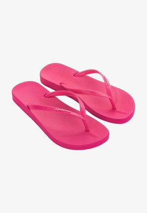 Infradito rosa con plantare testurizzato, cinturini sottili e design semplice, realizzate in materiale gommoso flessibile.