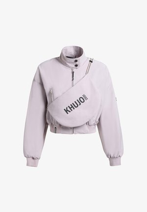 Light purple cropped jacket with high collar and front zipper, paired with a matching crossbody bag labeled "KHUJO 2001."