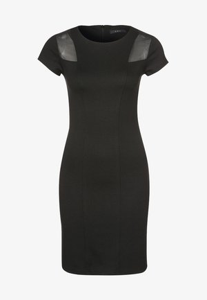 Černé priléhavé šaty s krátkými rukávy, s průsvitnými černými vložkami na ramenou. Vyrobené z elastického materiálu s přiléhavým střihem.