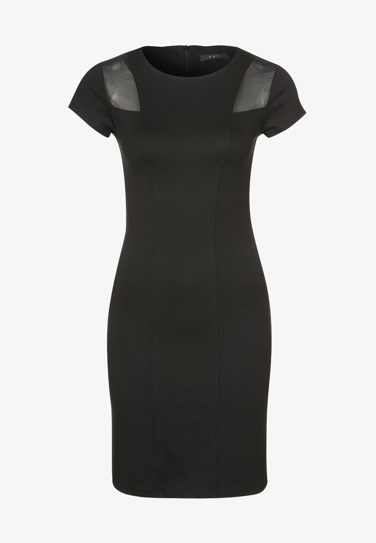 Robe moulante noire à manches courtes, avec des insertions noires transparentes sur les épaules. Fabriquée en matière extensible avec une silhouette ajustée.