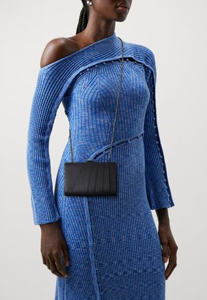 Blue ribbed dress with an off-shoulder design and button accents. Features a black textured crossbody bag with a chain strap.