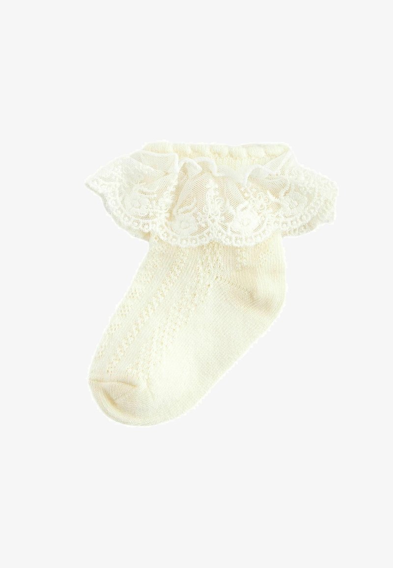 Elfenben strømpebukser med en flæse-lace top, der har teksturerede strikmønstre på kroppen og subtile ribbninger langs kanten.