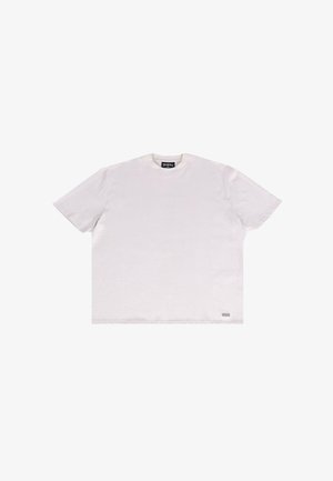 White cotton t-shirt with short sleeves, crew neck, and a small tag detail on the bottom left hem. Soft texture with a relaxed fit.