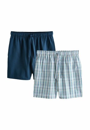 Două perechi de pantaloni scurți pentru bărbați cu talie elastică, unul uni albastru închis și unul alb cu model în carouri albastre și verzi, ambele cu șnururi.