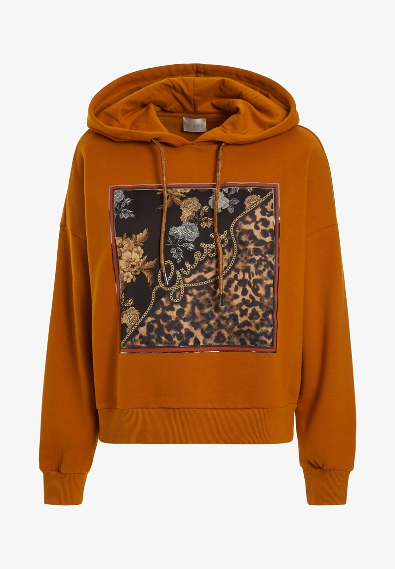 Sweat à capuche orange rouille avec carré avant à motif floral et léopard et logo "Guess" en design de chaîne dorée.