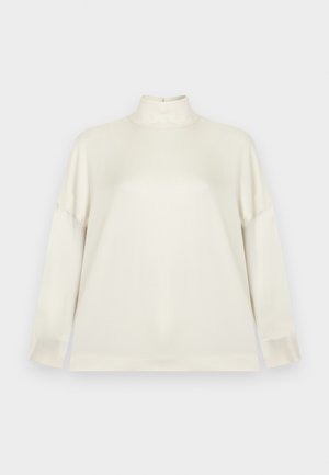 Kremfarvet rullekravebluse med lange ærmer, designet i et glat, elastisk stof. Har en afslappet pasform og minimal detaljer for et rent udseende.