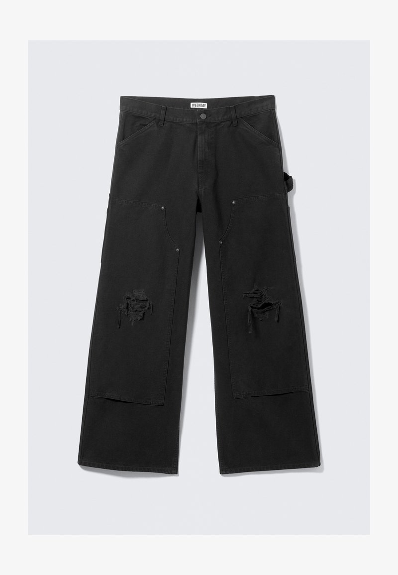Pantalon cargo noir à jambes larges avec une taille haute, doté de grandes poches avant et de zones usées. Fabriqué en coton durable.