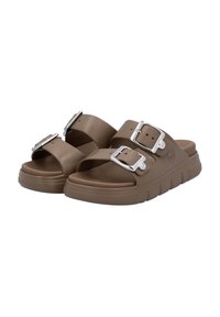 Brown slide sandals with two wide straps and silver buckles. Soft material, textured sole, and slightly raised platform design.