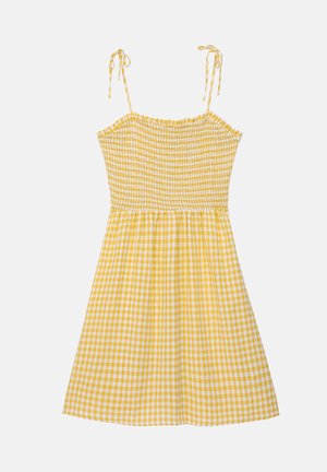 Sárga kockás ruha, ráncolt mellszélességgel, állítható pántokkal és bővülő szoknyával. Az egész ruhán kockás minta található.