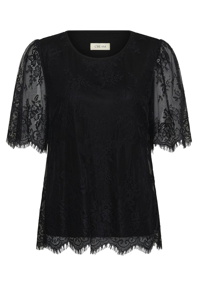 Blouse noire en dentelle à manches courtes avec motif floral, bords festonnés et encolure ronde de la marque Cream.
